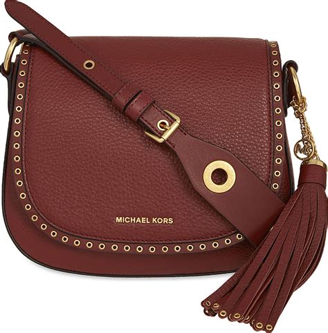 Michael Kors plum Brooklyn saddle bag tassel grommet cross 